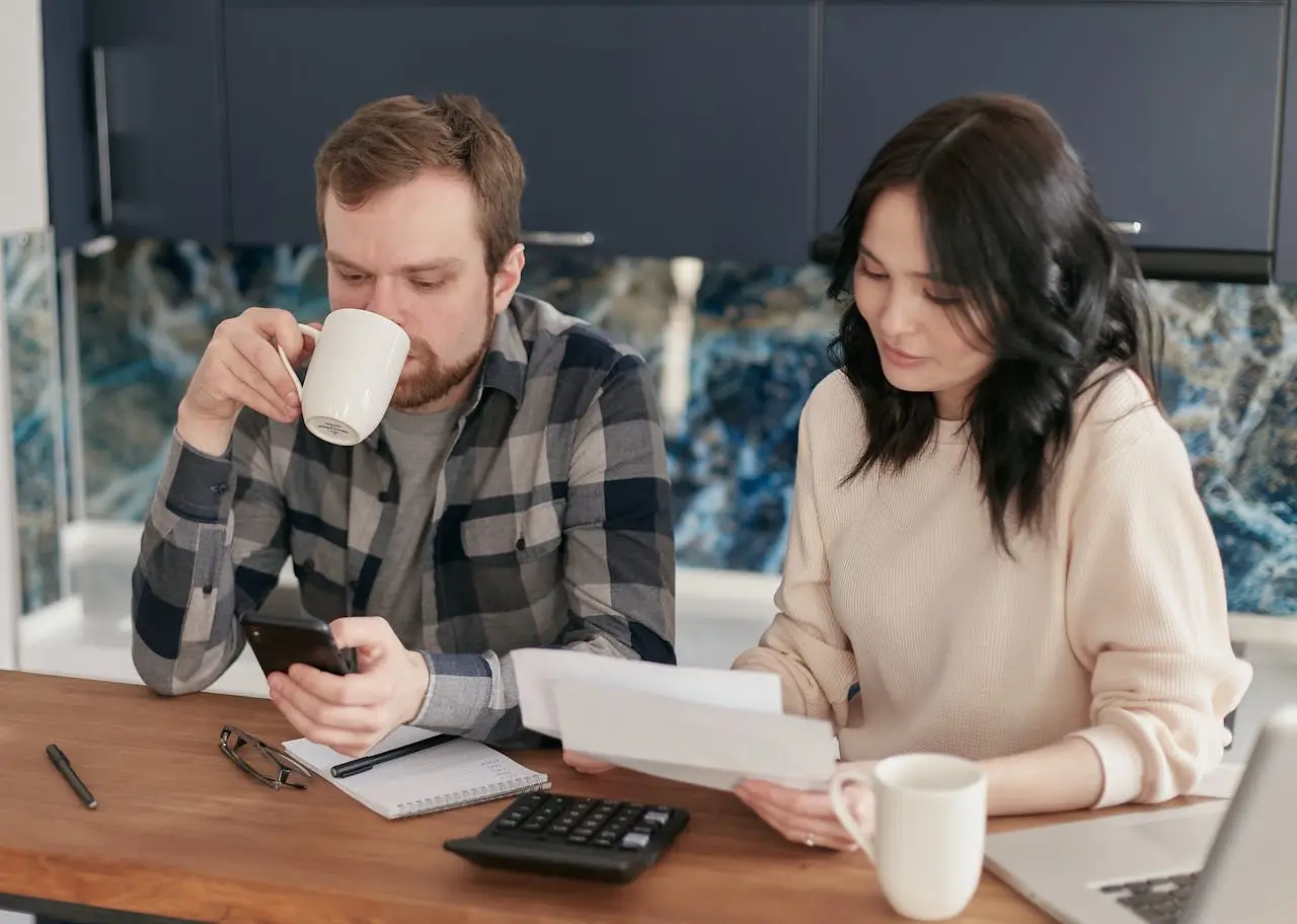 Couple planning a shared budget together at a table